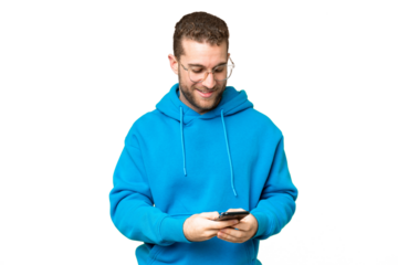 Young handsome blonde man over isolated chroma key background sending a message with the mobile