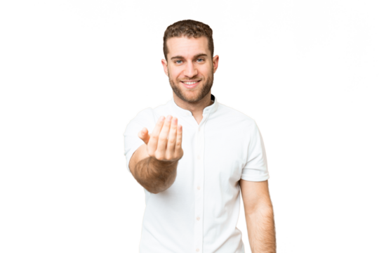 Young handsome blonde man over isolated chroma key background inviting to come with hand. Happy that you came