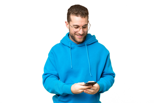 Young handsome blonde man over isolated chroma key background sending a message with the mobile