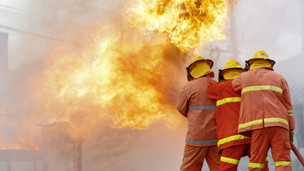 close-up photo of a firefighter Firefighters train firefighters using water and fire extinguishers...