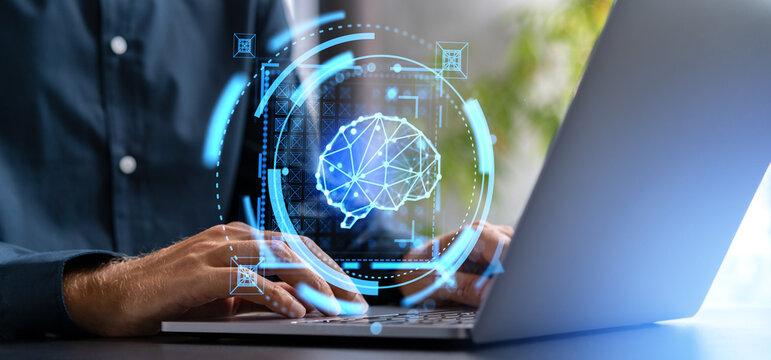 Man hands typing on laptop with AI brain hologram