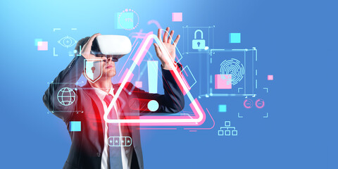 Businessman in vr glasses, red alert symbol hologram and cybersecurity