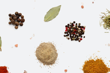 Heaps of aromatic spices on light background