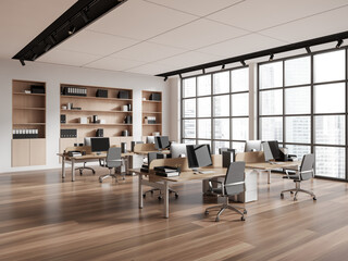 Modern coworking interior with pc computer in row, panoramic window