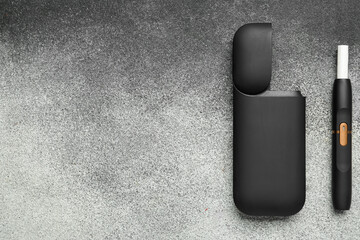 Modern electronic cigar on grey grunge background