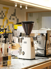 Coffee maker in a cafe, blurred background
