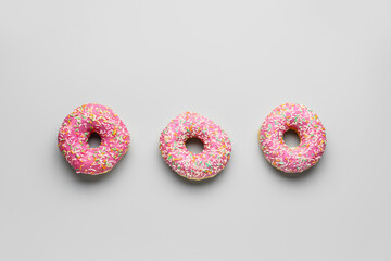 Sweet donuts on grey background