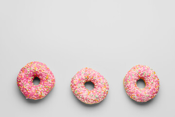 Sweet donuts on grey background
