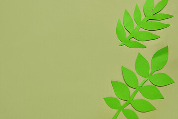 Beautiful origami leaves on color background