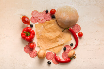 Different ingredients for preparing pizza on light background