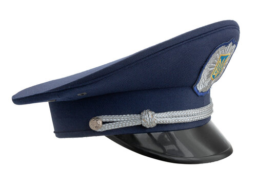 Dnipro, Ukraine - April 23, 2023: Peaked cap of a policeman of Ukraine, a trident on a cockade, cut out on an isolated background