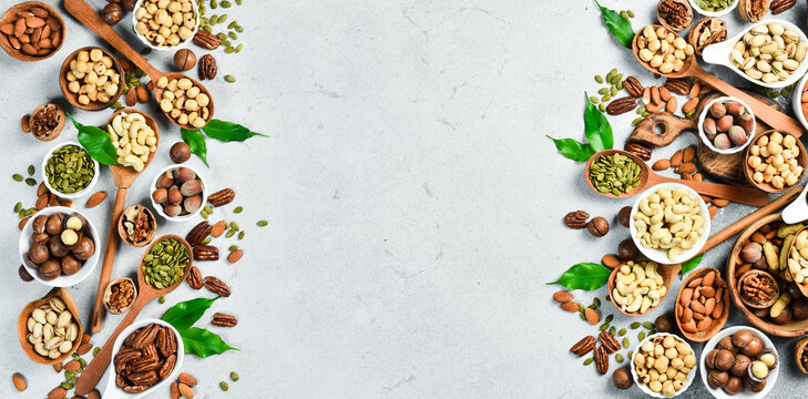 assorted nuts and dried fruit collection. Assorted nuts almonds, pistachio, cashews, walnut. Organic mixed nuts background. Healthy food, useful microelements and vitamins. Useful health snack.