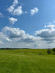A wonderful open-air park. sunny weather and light clouds in the sky create an amazing atmosphere. Beautiful sunny summer day