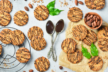 Oatmeal cookies with nuts and chocolate and gray stone background. Top view, space for text.