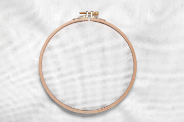 Wooden embroidery hoop with canvas as background © Pixel-Shot