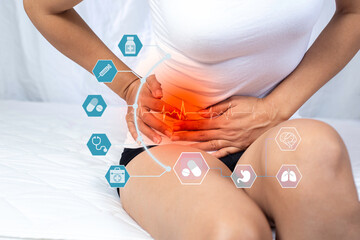 Woman having menstrual pain, abdominal pain problems, indigestion. Poor excretion, chronic...