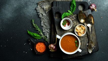 Healthy dietary lentil soup in a white bowl. Free space for text. Close up.