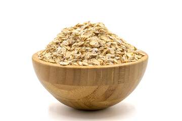 Oatmeal or Oat flakes isolated on white background. Oatmeal in wooden bowl
