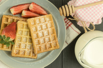Fresh waffles on the table, freshly baked Belgian waffles