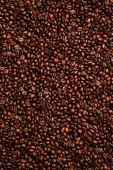 roasted coffee bean background, top view. Macro photo. Free space for text.