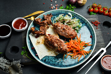 Grilled Lula kebab from lamb on the bone. Azerbaijani cuisine. Free space for text. Close up.
