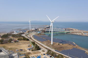 Landscape with wind turbine and sea view
