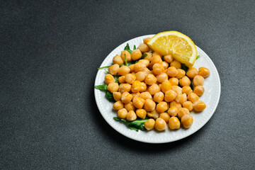 Boiled chickpeas with lemon and spices. Azerbaijani cuisine. Free space for text. Close up.