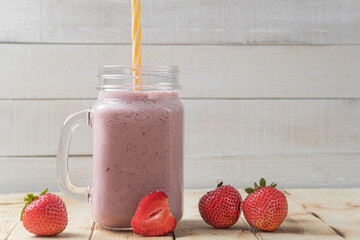 Tasty and healthy breakfast, milkshake with fresh fruit. Strawberry milkshake