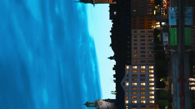 Stockholm, Sweden. Vertical Footage Video. Scenic Skyline View Of Famous Tower Of Stockholm City Hall. Building Of Municipal Council. Famous Popular Destination Place In Dusk Lights. Night Lighting.