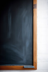 Fototapeta na wymiar School educational chalk board wichit on the wall stained with chalk. Generative AI