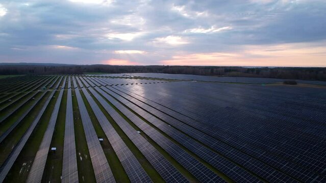 Aerial riser reveals big area covered under solar panels to produce green energy
