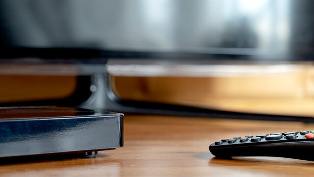 digital TV set-top box in front of the TV
