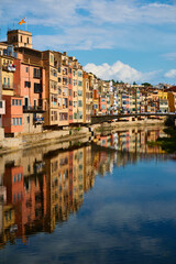 Fototapeta na wymiar The colored houses on the banks of the River Ter, called Casas del Onyar, in Girona. Catalonia. Spain