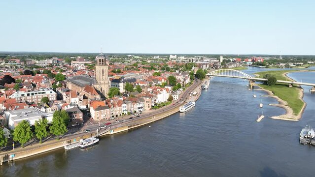 Aerial drone video of Deventer, along the Ijssel river, city skyline.
