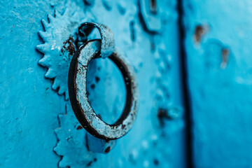 Vibrant blue house post: Numbers adorn this eye-catching house post, creating an intriguing focal...