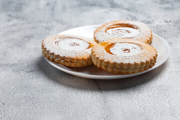 cookies with jam on a dish.
