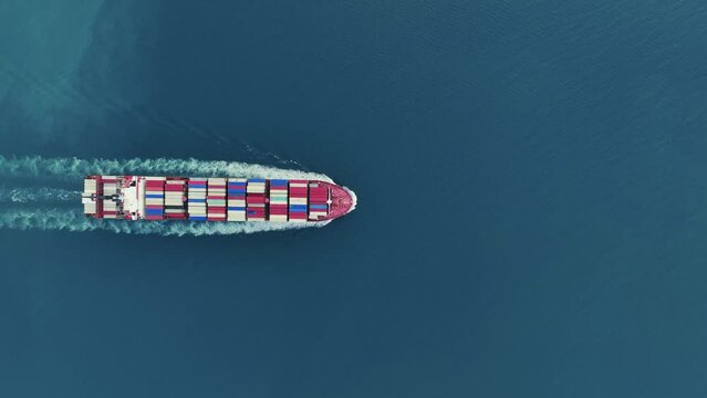 Cargo container Ship, cargo maritime ship with contrail in the ocean ship carrying container and running for export  concept technology freight shipping sea freight by Express Ship. top view 
