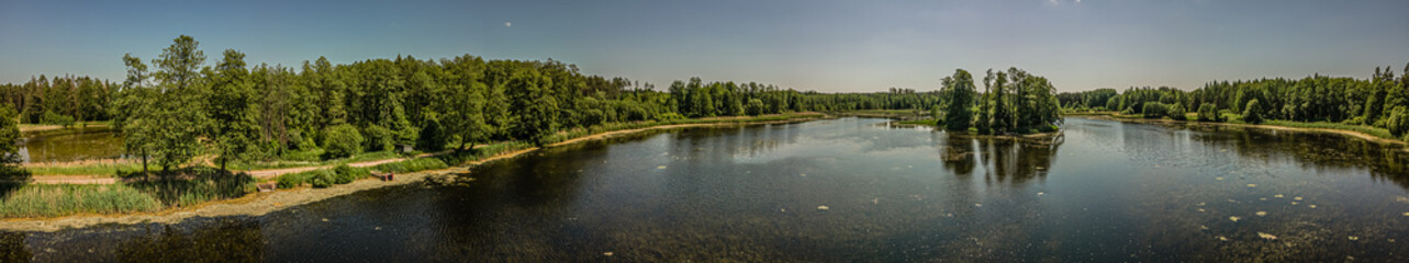 Aerial panorama of the lake in the forest in Podlasie ,Poland on a sunny,spring day.