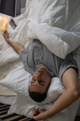 Lazy man oversleep, wake up late, hit the alarm clock frequently with madness. Modern lifestyles...