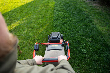 Lawn mover on green grass. Machine for cutting lawns.