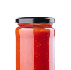 Tomato paste in a glass jar on a white background
