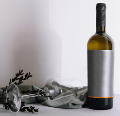 glass and bottle of wine on white