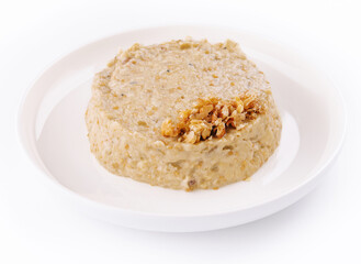 Oatmeal porrige in white plate isolated