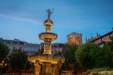 Gigantones Fountain at Plaza de Bib-Rambla Square at night with Cathedral Tower - Granada, Andalusia, Spain