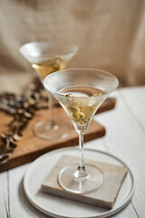 Martini cocktail with green olives