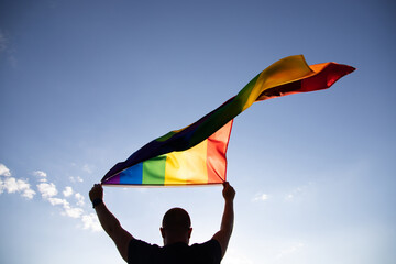 Young man with LGBT flag.