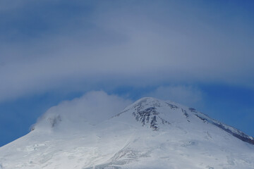 Evening Mount Elbrus with clouds in the Caucasus
