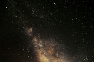 The Milky Way galaxy core in natural color in the night sky.