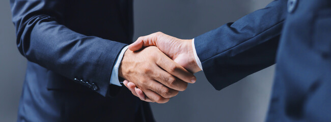 closeup business shake hand in office
