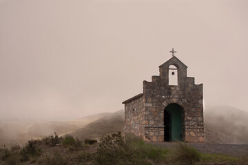 Small chapel in the middle of the mist on the mountain - Catamarca, Argentina